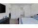 Bedroom with TV, dresser, and an en-suite bathroom with glass-enclosed shower at 4315 E Cactus Canyon Dr, Pahrump, NV 89061
