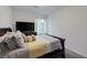 Bedroom featuring a comfortable bed, neutral color scheme, and a large TV on a dresser at 4315 E Cactus Canyon Dr, Pahrump, NV 89061