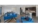 Open concept living room, kitchen, and dining area with modern furnishings at 4315 E Cactus Canyon Dr, Pahrump, NV 89061