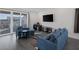 Comfortable living room with hardwood floors and a large sliding glass door to the patio at 4315 E Cactus Canyon Dr, Pahrump, NV 89061
