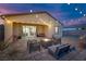 Cozy outdoor patio featuring a stone fire pit and comfortable seating at 4315 E Cactus Canyon Dr, Pahrump, NV 89061