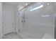 Bathroom featuring a modern shower stall with glass doors and white tiling at 4315 E Cactus Canyon Dr, Pahrump, NV 89061
