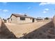 Large, spacious backyard with block wall fencing; property is awaiting landscaping at 4921 E Washington Ave, Las Vegas, NV 89110