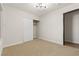 Bright bedroom featuring modern lighting and an opened closet at 4921 E Washington Ave, Las Vegas, NV 89110
