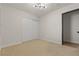 Neutral bedroom with sliding closet doors and wood flooring in the entrance at 4921 E Washington Ave, Las Vegas, NV 89110