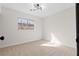 Bedroom with neutral carpet, natural light, and modern light fixture at 4921 E Washington Ave, Las Vegas, NV 89110