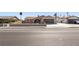 Single-story home with desert landscaping, a front yard wall, and an attached two-car garage at 4921 E Washington Ave, Las Vegas, NV 89110