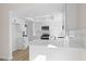 Stylish kitchen with modern white cabinetry, stainless appliances, and quartz countertops at 4921 E Washington Ave, Las Vegas, NV 89110