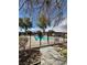 Community pool enclosed by a black metal fence in a neighborhood at 5083 Village Dr, Las Vegas, NV 89142