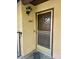 Close-up of the front door showing the house number and light fixture at 5083 Village Dr, Las Vegas, NV 89142