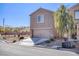 Two-story stucco home with attached two-car garage and desert landscaping at 5285 Bombazine St, Las Vegas, NV 89122