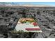 Aerial view featuring a pool, a sprawling lot, and mountain views at 5340 N Campbell Rd, Las Vegas, NV 89149