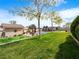 Beautiful backyard featuring a manicured lawn, putting green, and swimming pool at 5340 N Campbell Rd, Las Vegas, NV 89149