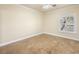 Bedroom with tile floors, baseboard trim, ceiling fan, and a large window at 5340 N Campbell Rd, Las Vegas, NV 89149
