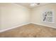 This bedroom features a window view, base molding and tile flooring at 5340 N Campbell Rd, Las Vegas, NV 89149