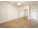 Bedroom with tile floors, ceiling fan, baseboard trim, and mirrored closet doors at 5340 N Campbell Rd, Las Vegas, NV 89149
