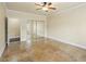 Bedroom with tile floors, baseboard trim, and mirrored closet doors at 5340 N Campbell Rd, Las Vegas, NV 89149