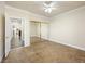 This bedroom features tile floors, base molding and a mirrored closet at 5340 N Campbell Rd, Las Vegas, NV 89149