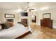 Spacious main bedroom featuring tile floors, a fireplace, and plenty of natural light at 5340 N Campbell Rd, Las Vegas, NV 89149