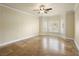 Spacious bedroom with tile flooring, ceiling fan, and bright bay windows at 5340 N Campbell Rd, Las Vegas, NV 89149
