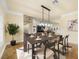 Staged dining room with hardwood floors, neutral walls, and natural light at 5340 N Campbell Rd, Las Vegas, NV 89149