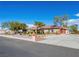 Spacious single-story home with a well-manicured front yard and an expansive driveway at 5340 N Campbell Rd, Las Vegas, NV 89149
