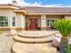 Welcoming home entrance with a red front door and desert-style landscaping at 5340 N Campbell Rd, Las Vegas, NV 89149