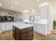 Island kitchen offers plenty of counter space, natural light, and seamless transition to other areas at 5340 N Campbell Rd, Las Vegas, NV 89149