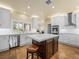 Kitchen boasts a large island, stainless steel appliances, and white cabinetry, offering style and functionality at 5340 N Campbell Rd, Las Vegas, NV 89149