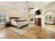 Spacious bedroom with a fireplace and an en-suite bathroom featuring a soaking tub at 5340 N Campbell Rd, Las Vegas, NV 89149