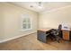 Home office featuring a desk, ceiling fan, and a large window at 5340 N Campbell Rd, Las Vegas, NV 89149