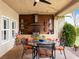 Charming outdoor kitchen area with seating, wooden accents and grill, ideal for al fresco dining and entertaining at 5340 N Campbell Rd, Las Vegas, NV 89149