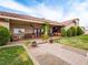 Back patio featuring covered seating, dining, and a well-manicured lawn at 5340 N Campbell Rd, Las Vegas, NV 89149