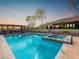 Backyard oasis featuring a sparkling pool and spa with an outdoor living space for entertaining at 5340 N Campbell Rd, Las Vegas, NV 89149