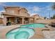 Inviting backyard features a pristine pool and spa, perfect for relaxation and entertaining with outdoor seating area at 6709 Rancho Santa Fe Dr, Las Vegas, NV 89130