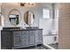 Main bathroom showcasing dual sinks, a vanity, and a walk-in shower with bench at 6709 Rancho Santa Fe Dr, Las Vegas, NV 89130