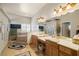 Well-lit bathroom features double sinks, a soaking tub, and neutral tones throughout the space at 671 W Hickory St, Pahrump, NV 89048