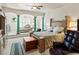 Serene bedroom with sitting area with abundant natural light and tasteful decor at 671 W Hickory St, Pahrump, NV 89048