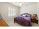 Cozy bedroom featuring a comfortable bed, neutral walls, and window with white shutters at 671 W Hickory St, Pahrump, NV 89048