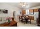 Inviting living room with a dining area and comfortable seating, filled with natural light at 671 W Hickory St, Pahrump, NV 89048