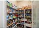 Walk-in pantry with organized shelving providing ample storage for groceries and kitchen essentials at 671 W Hickory St, Pahrump, NV 89048