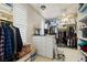 Organized walk-in closet featuring ample shelving, drawers, and storage space for clothing and accessories at 671 W Hickory St, Pahrump, NV 89048