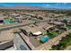 Spacious backyard featuring a sparkling pool, covered patio, and mountain views at 7119 Falabella Ridge Ave, Las Vegas, NV 89131