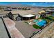 Backyard featuring a private pool, adjacent spa, patio, and easy to maintain desert landscaping at 7119 Falabella Ridge Ave, Las Vegas, NV 89131
