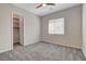 Bedroom with neutral walls, carpet, ceiling fan, closet with shelving and a window with blinds at 7119 Falabella Ridge Ave, Las Vegas, NV 89131