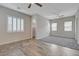 A generously sized bedroom boasts gray carpet, abundant natural light, and a view to the connecting bathroom at 7119 Falabella Ridge Ave, Las Vegas, NV 89131