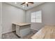 Bonus room or office with a desk or island and a large shuttered window providing natural light at 7119 Falabella Ridge Ave, Las Vegas, NV 89131