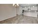 Dining room with gray wood flooring, backyard access and recessed lighting at 7119 Falabella Ridge Ave, Las Vegas, NV 89131