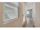 Hallway featuring gray wood flooring and window at 7119 Falabella Ridge Ave, Las Vegas, NV 89131