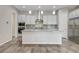 Kitchen featuring white cabinets, granite countertops, and stainless steel appliances at 7119 Falabella Ridge Ave, Las Vegas, NV 89131